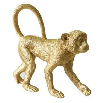 escultura de mono dorado 