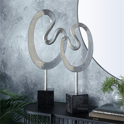 Escultura abstracta aluminio plateado